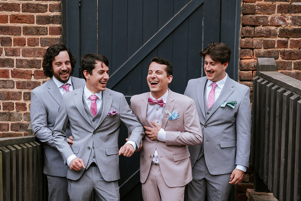 grey suit and pink floral bowtie necktie 